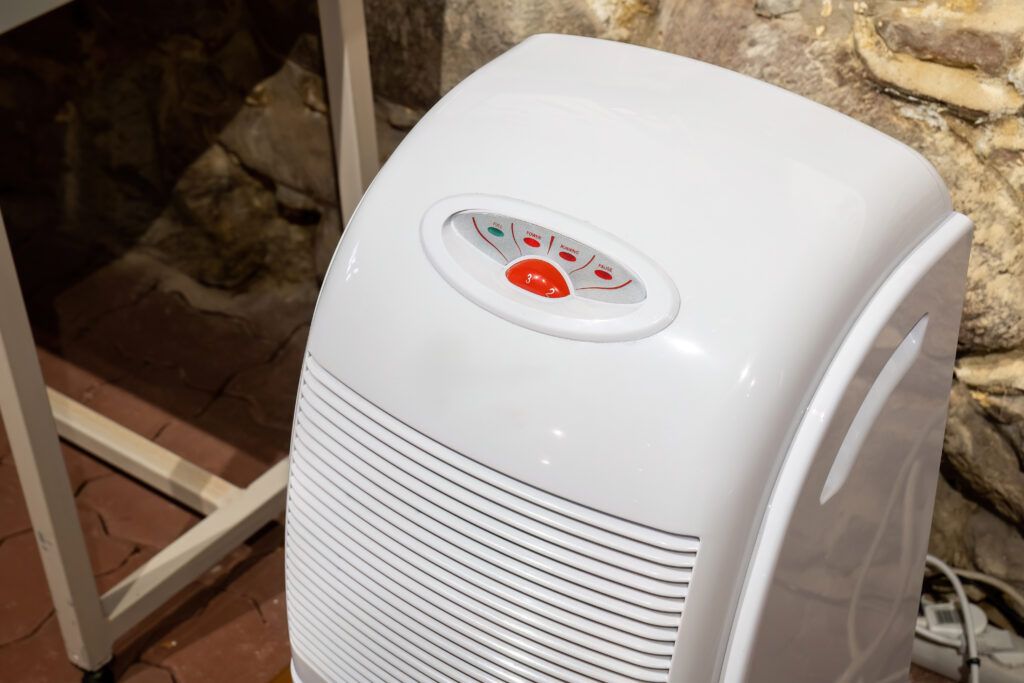 A dehumidifier sits in a basement